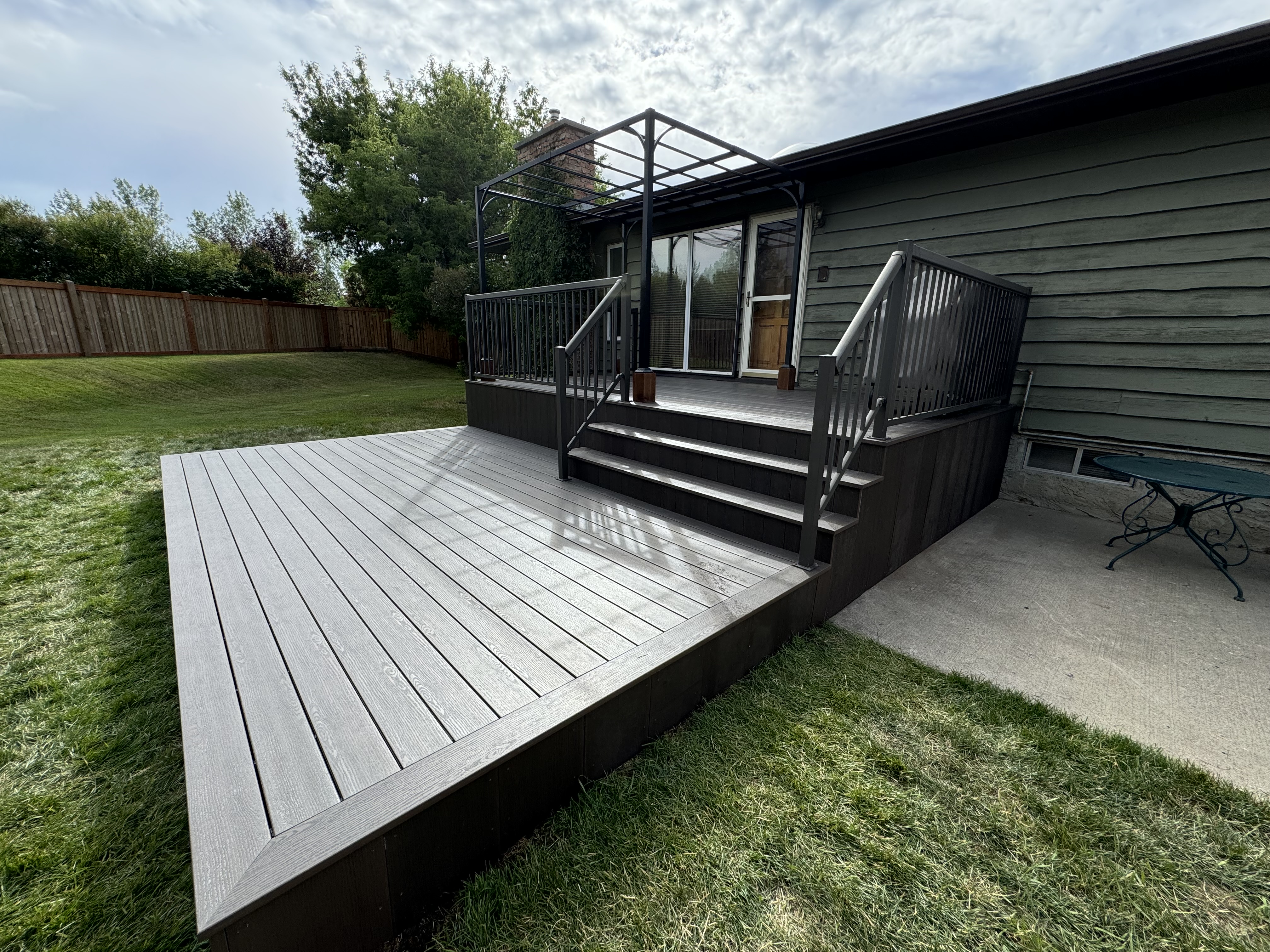 Custom composite deck with pergola — Edmonton
